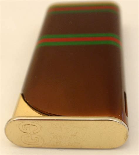 Gucci Vintage Signature Gold Stripped Lighter, Circa 1970 